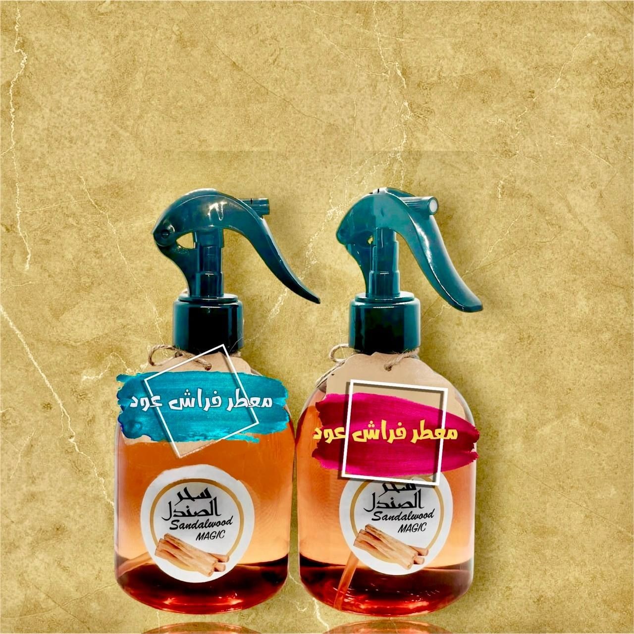 Two spray bottles labeled Sandalwood Magic on a textured background.